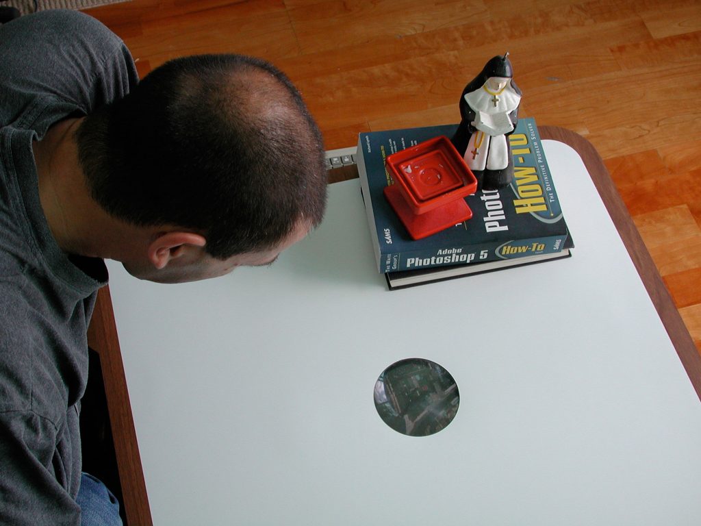 A photograph of a participant looking down into the viewport of the Drift Table